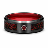 Front view of a black tungsten wedding ring with a red Celtic dragon inlay, red gemstone and polished red comfort fit interior on a white background.