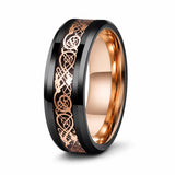 Black tungsten wedding ring with a rose gold Celtic inlay and polished rose gold comfort fit interior shown at an angled studio view on a white background.
