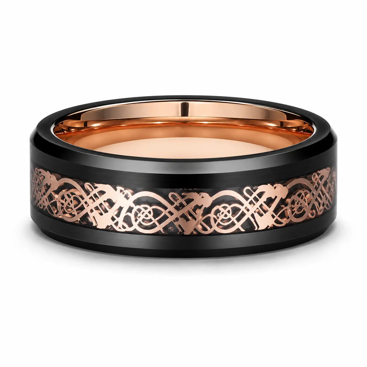 Black tungsten wedding ring with a rose gold Celtic inlay lying flat on a white studio background, showing the full width of the band and polished rose gold interior.