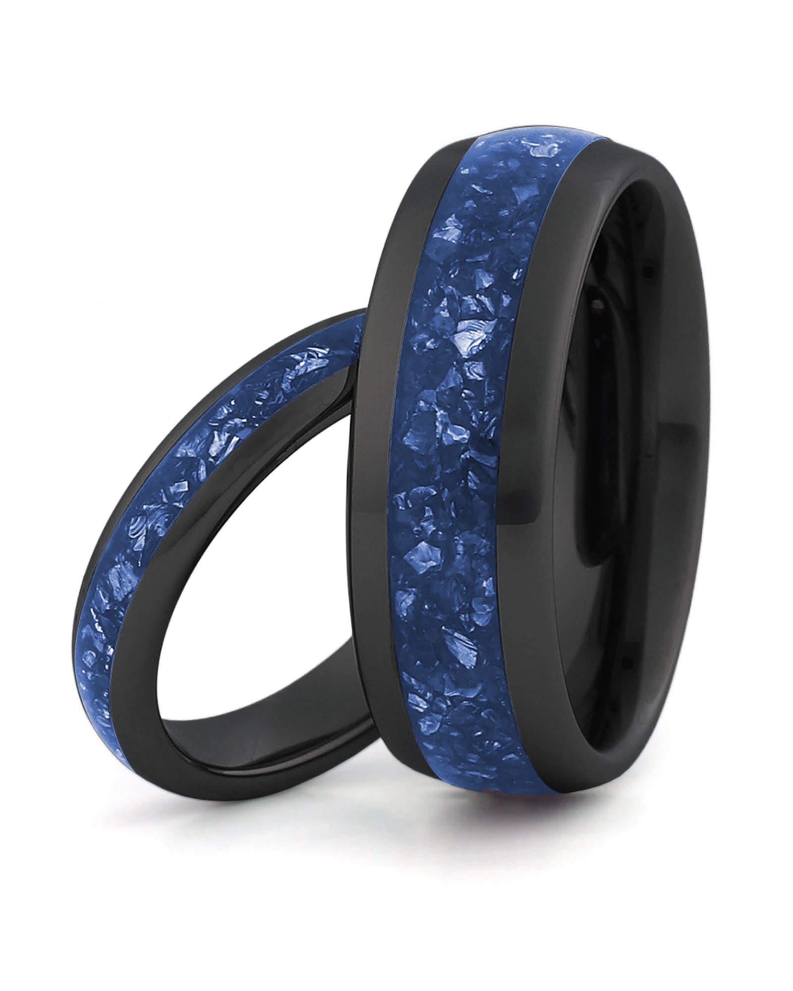 Matching black tungsten wedding rings with blue sapphire stone inlays