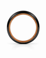Side profile of a black brushed tungsten wedding ring showing the band thickness, polished beveled edges and whiskey barrel wood interior on a white background.