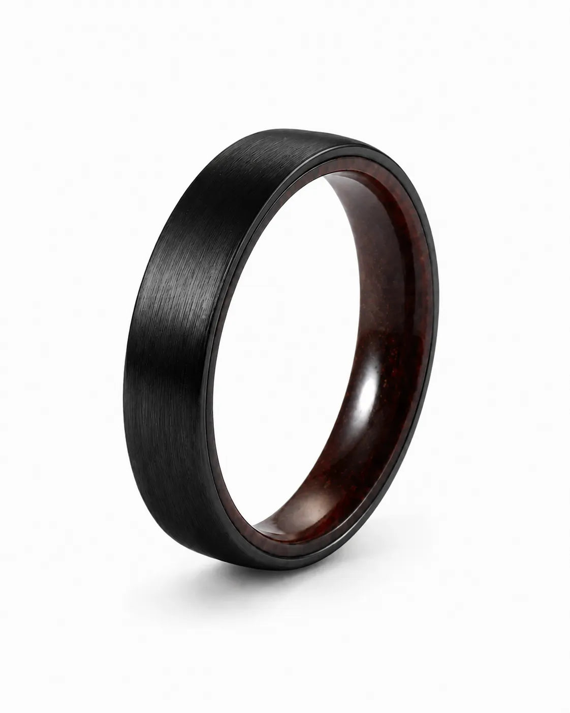 Brushed black tungsten wedding ring with a maple wood sleeve interior shown at an angled view on a white background.