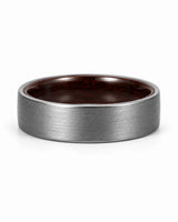 Low front view of a brushed silver tungsten wedding ring with a maple wood sleeve interior.