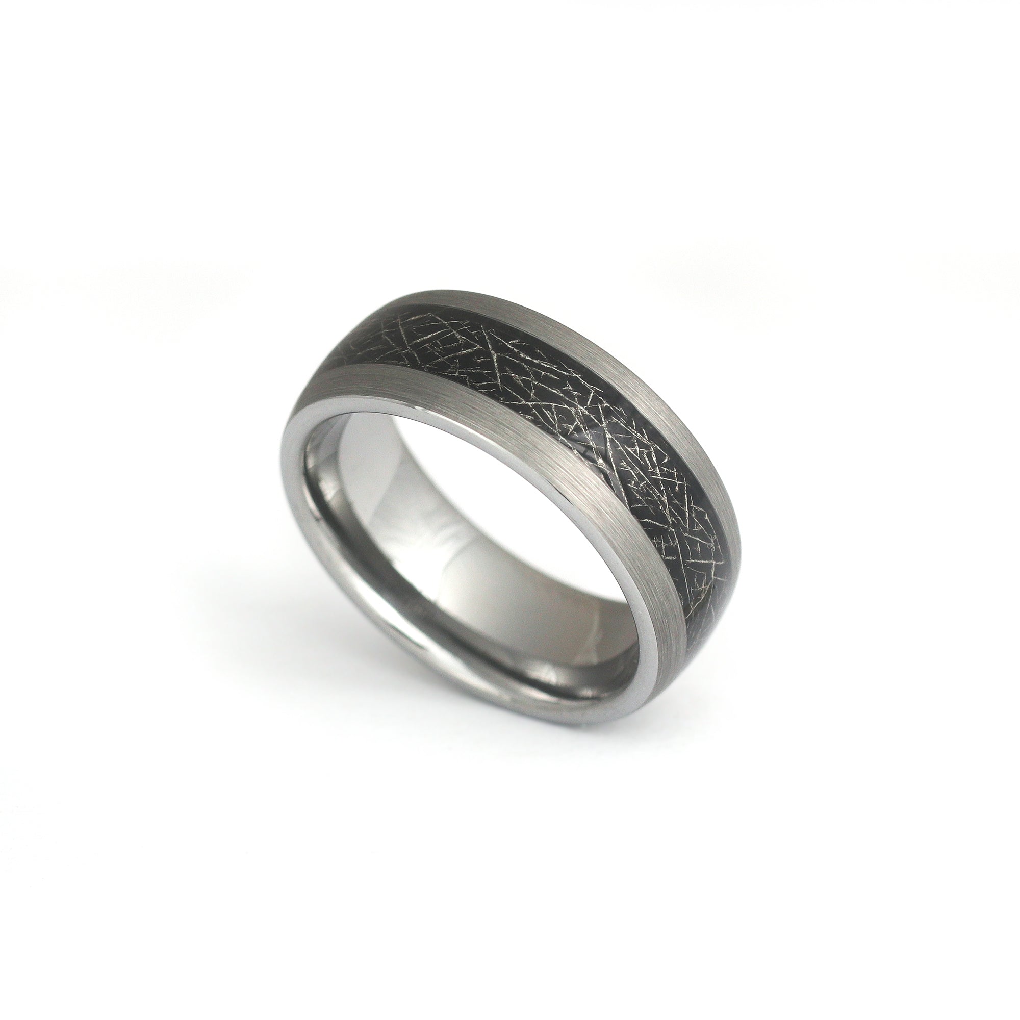 Unique meteorite wedding band on white background