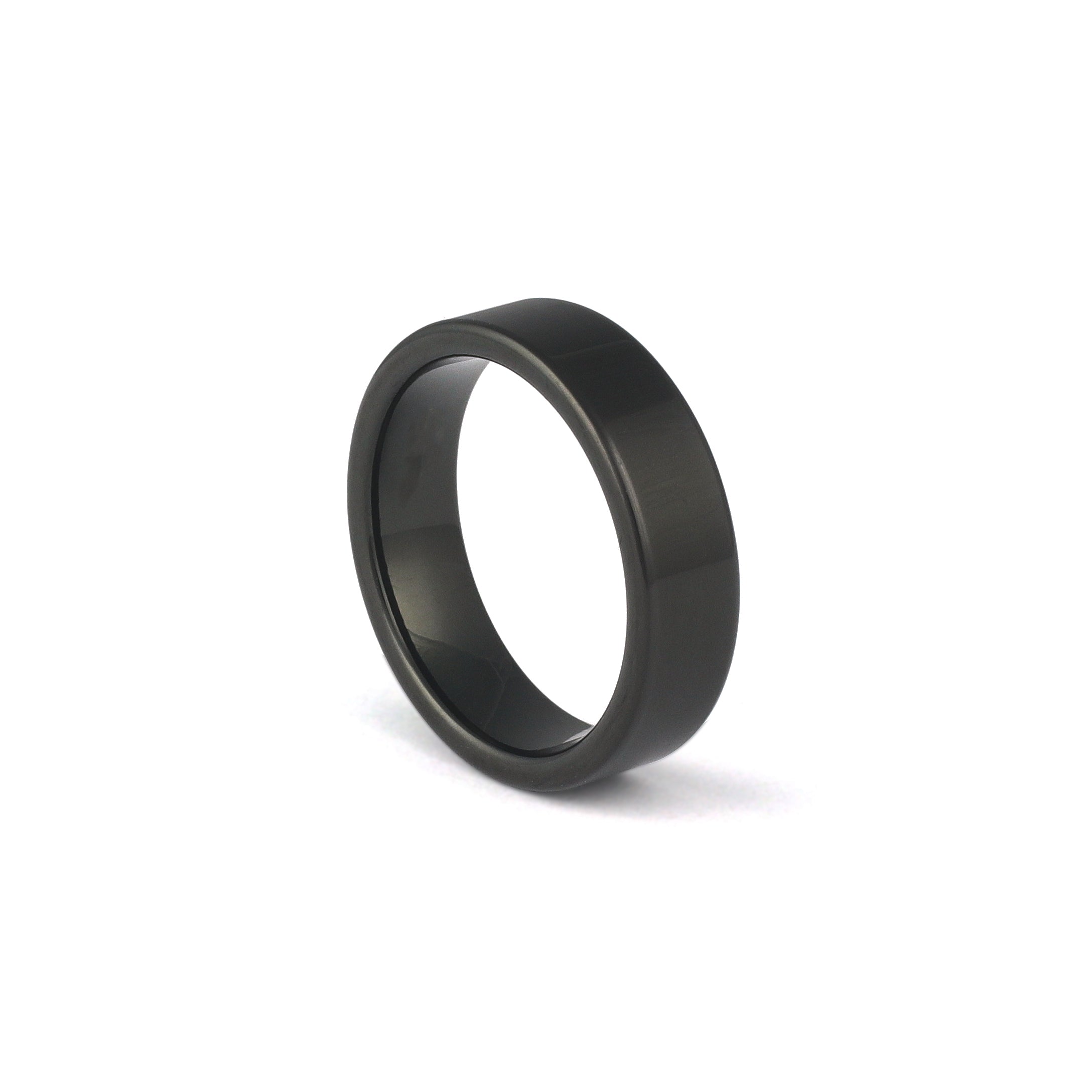 Black wedding band for him on white background