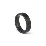 Black wedding band for him on white background