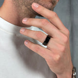 man wearing an all black men’s tungsten ring