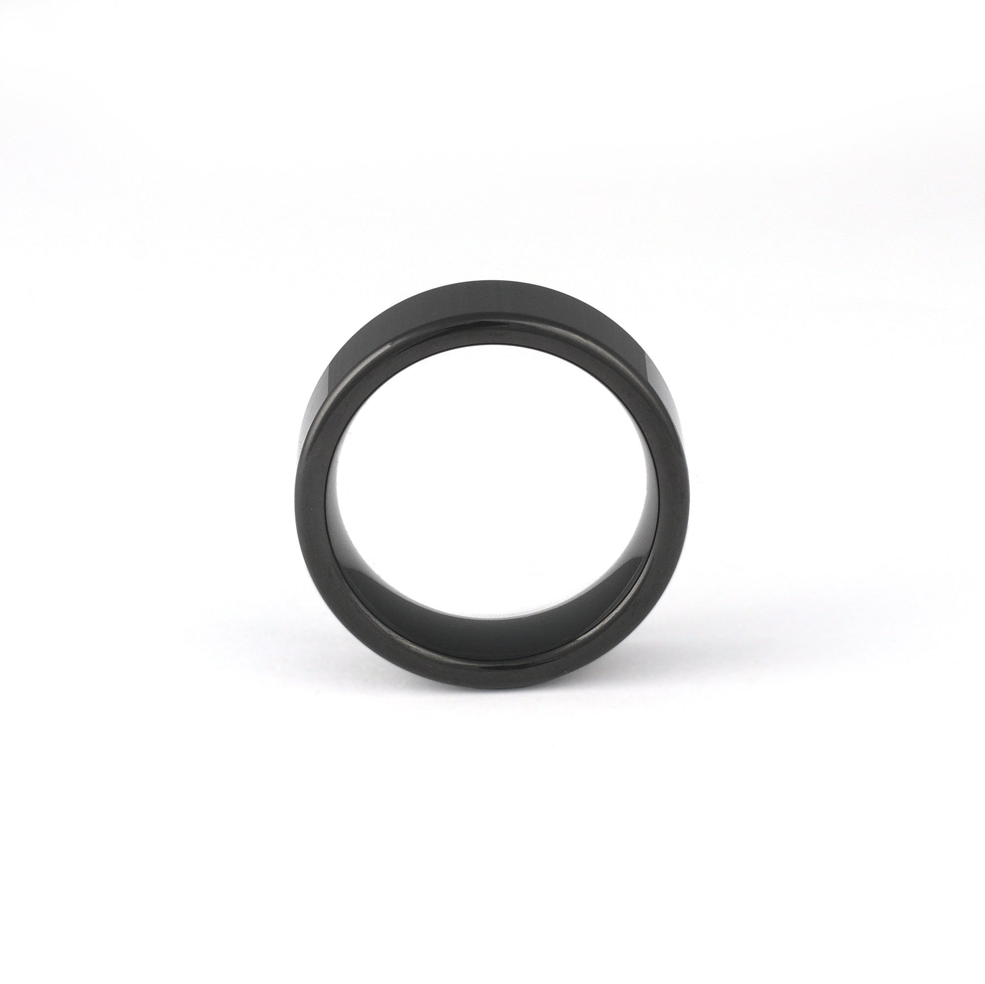 All black men’s tungsten ring on white background