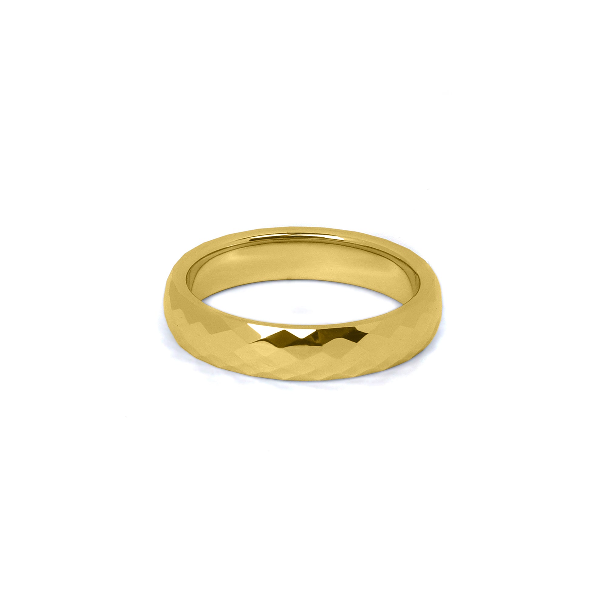 Close-up of gold faceted women’s wedding ring with comfort fit design