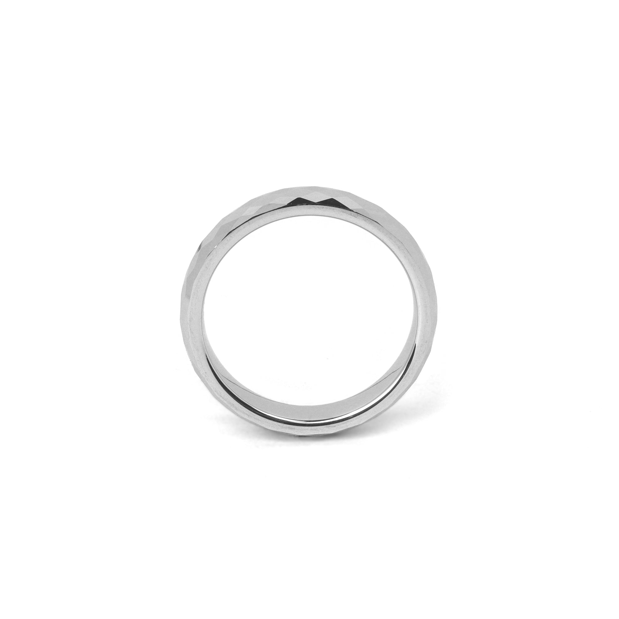 Women’s wedding ring silver, 4mm faceted tungsten band shown on plain background