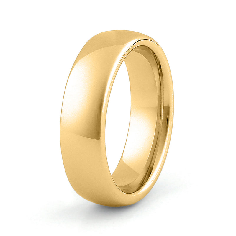 Polished gold tungsten wedding band photographed on a clean editorial background with premium masculine styling.