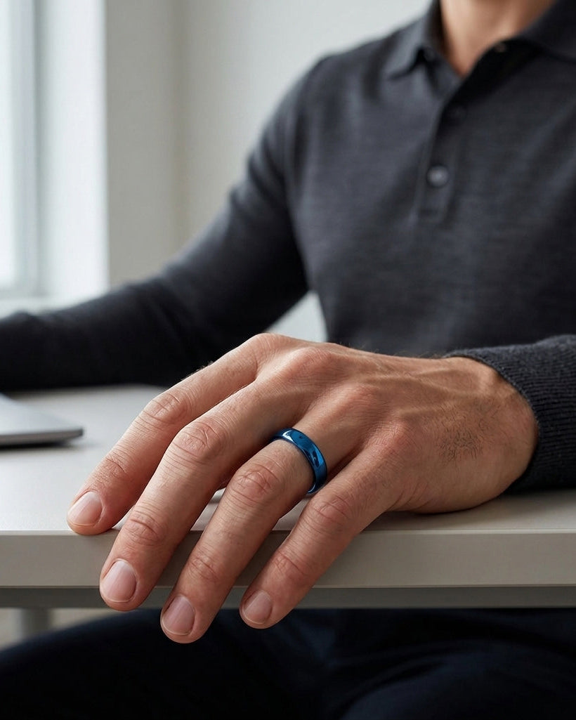 man wearing a blue polished tungsten wedding ring