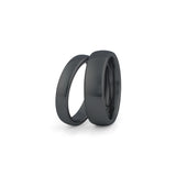 black wedding ring sets his and hers on white background
