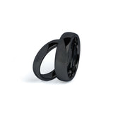 black wedding ring sets his and hers on white background