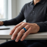 man wearing an 8mm polished blue tungsten wedding ring