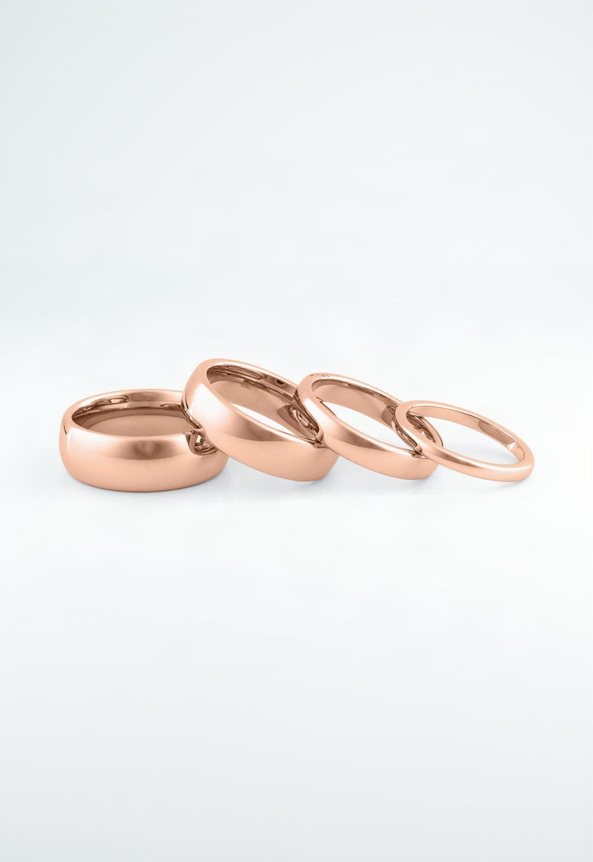 Elegant marriage rings couple in rose gold with smooth, shiny finish