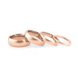 Elegant marriage rings couple in rose gold with smooth, shiny finish