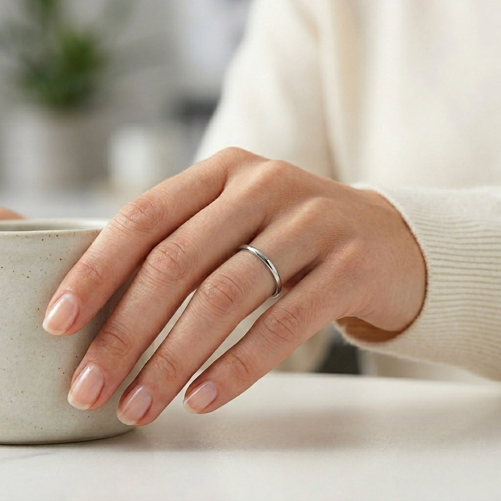 woman wearing a 2mm polished tungsten wedding band