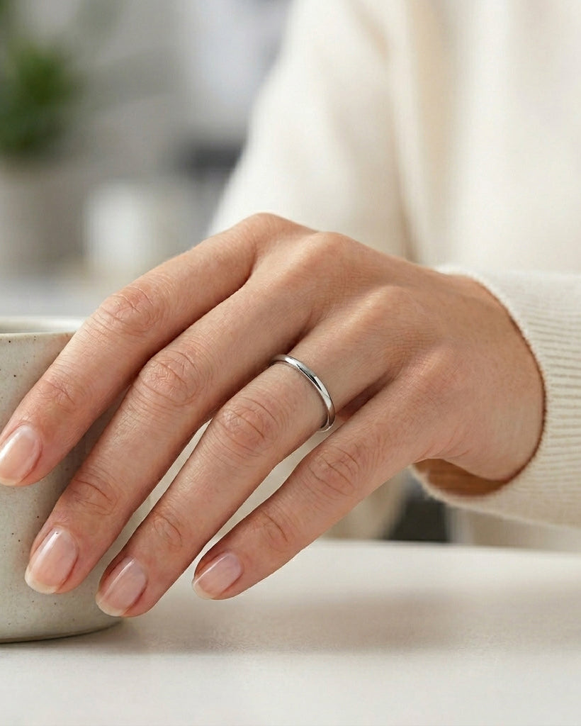 woman wearing a 2mm polished tungsten wedding band