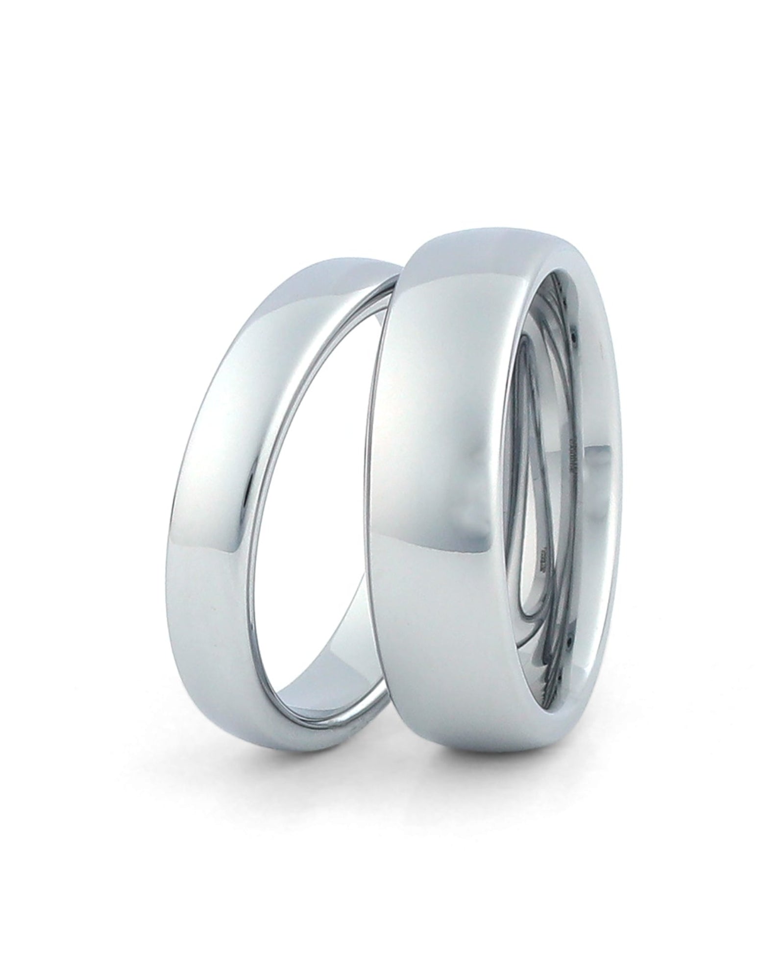Silver wedding bands for couples on white background