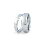 Silver wedding bands for couples on white background