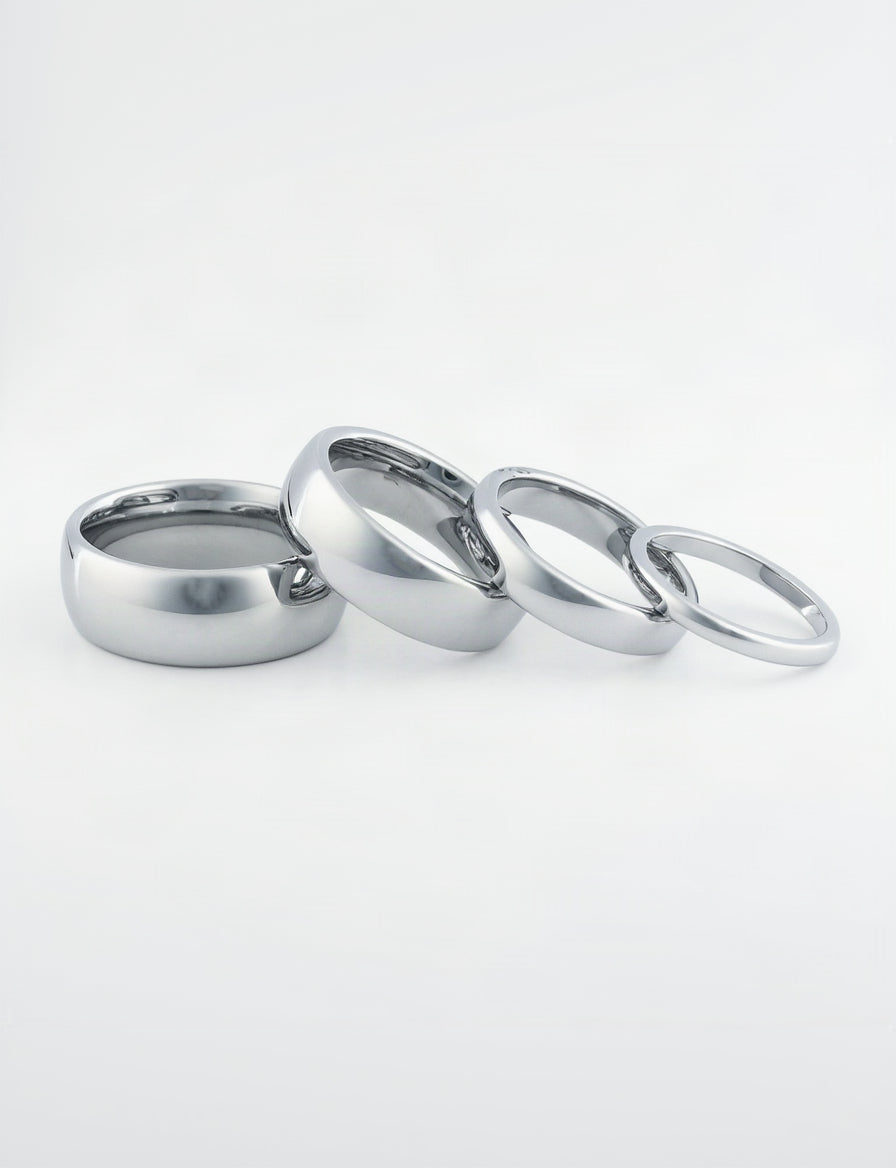 Close-up of tungsten wedding rings his and hers with scratch-resistant finish