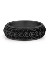 Black dragon scale spinner ring shown at an angle
