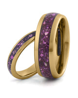 Matching gold tungsten wedding rings with amethyst inlays, including an 8mm band