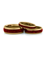 Gold ruby tungsten couples wedding ring set shown together