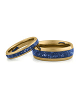 Matching gold wedding bands with blue sapphire stone inlays