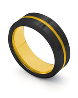 Black and gold Groove wedding ring shown at an angle
