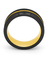 Side view of black and gold Groove wedding ring