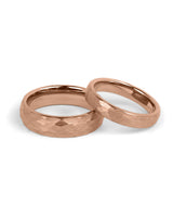 Matching rose gold tungsten wedding bands with hammered finish