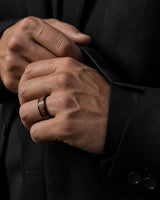 Man wearing a 6mm black koa wood wedding ring