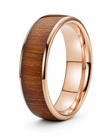 Men’s polished rose gold ring with a reddish-brown wood inlay, standing upright on a white background.