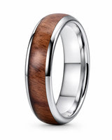 Men’s polished silver ring with a reddish-brown wood inlay, standing upright on a white background.