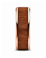 Side profile of a men’s ring featuring a reddish-brown wood inlay and polished rose gold edges.