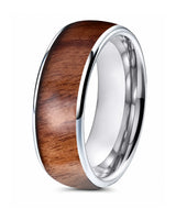Men’s polished silver ring with a reddish-brown wood inlay, standing upright on a white background.