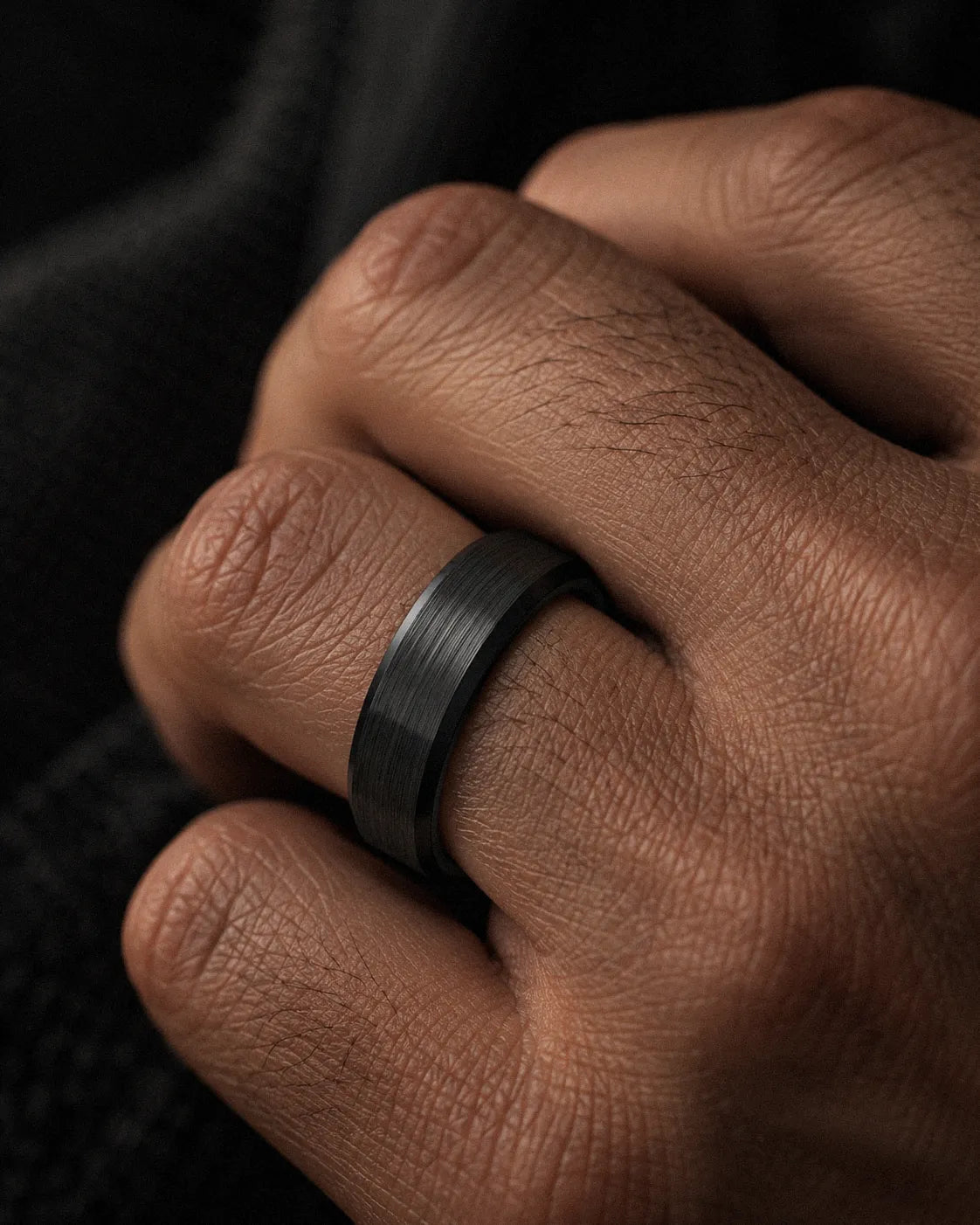 mens-black-brushed-tungsten-wedding-ring-macro.webp