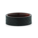 Top view of an 8mm men's hammered black tungsten wedding band with a real rosewood inlay.