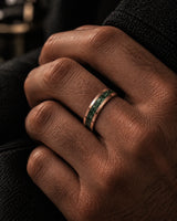 Man wearing a 6mm rose gold tungsten wedding ring with a natural green moss agate inlay.