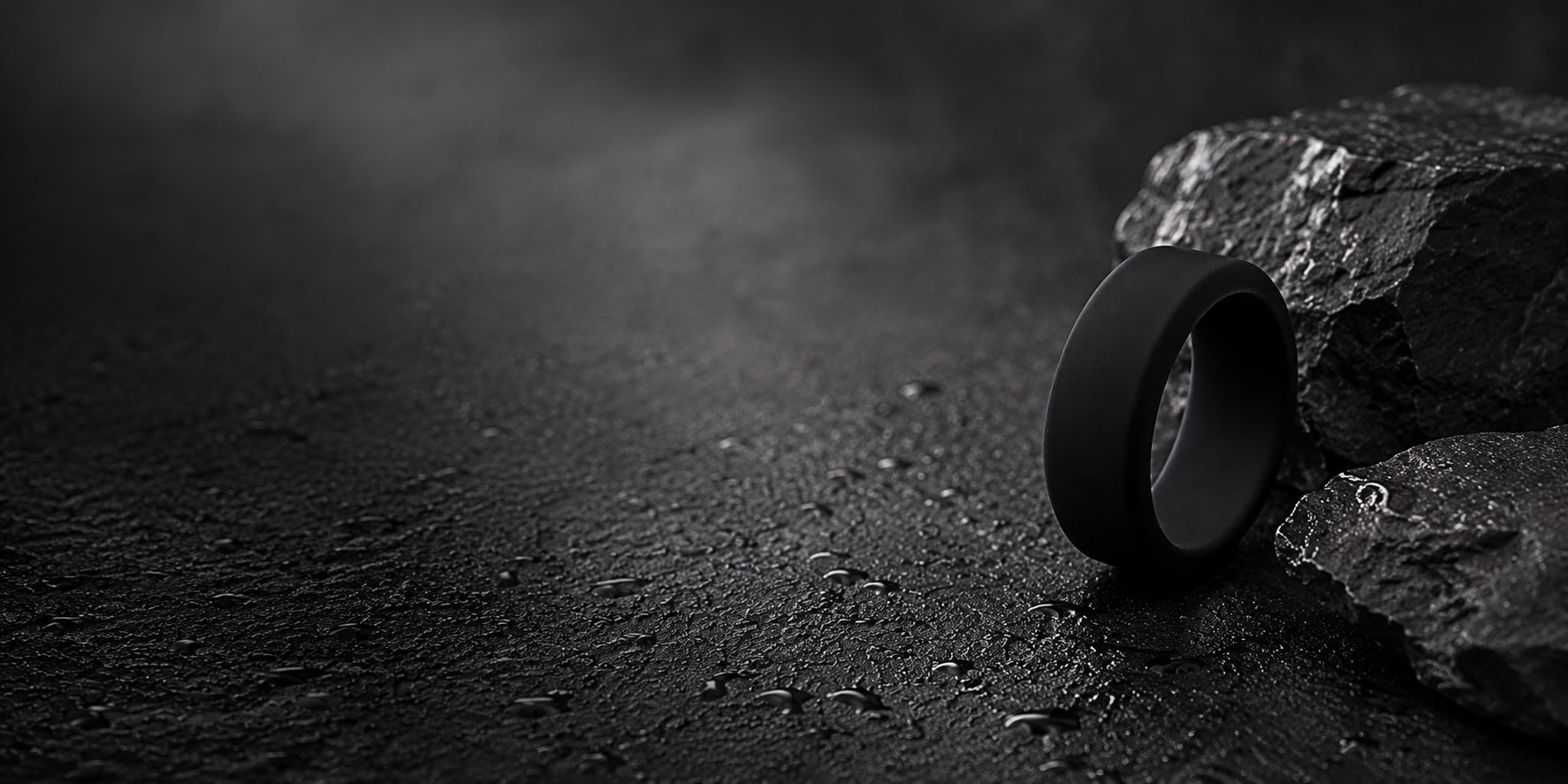 Premium black silicone men’s wedding ring collection hero banner with dark minimalist background and text space