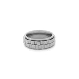silver anxiety ring with spinning gears photographed on white