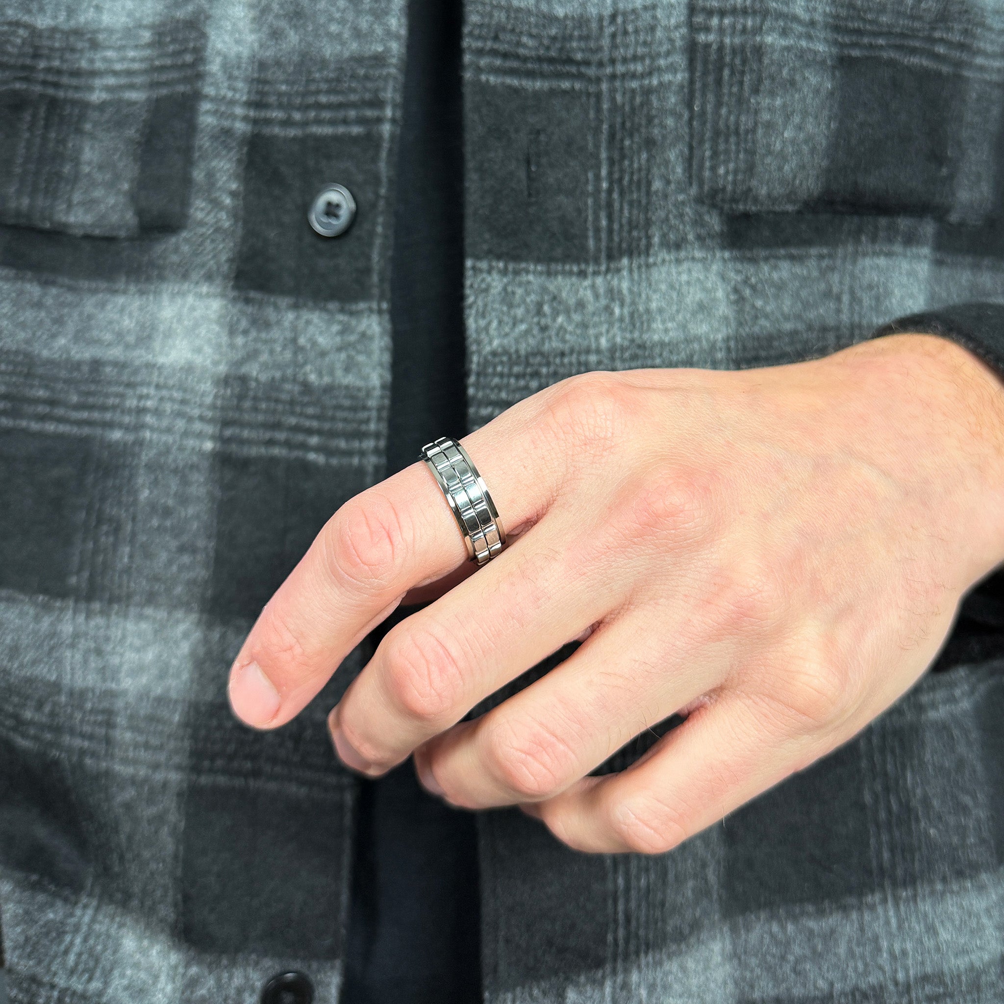 man wearing a silver fidget ring for men