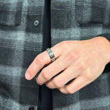 man wearing a silver fidget ring for men