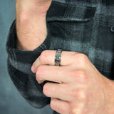 man wearing a silver fidget ring for men
