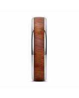 Side profile of a men’s ring featuring a reddish-brown wood inlay and polished silver edges.