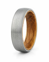 Men's brushed tungsten wooden wedding band with a real whiskey barrel wood inlay.