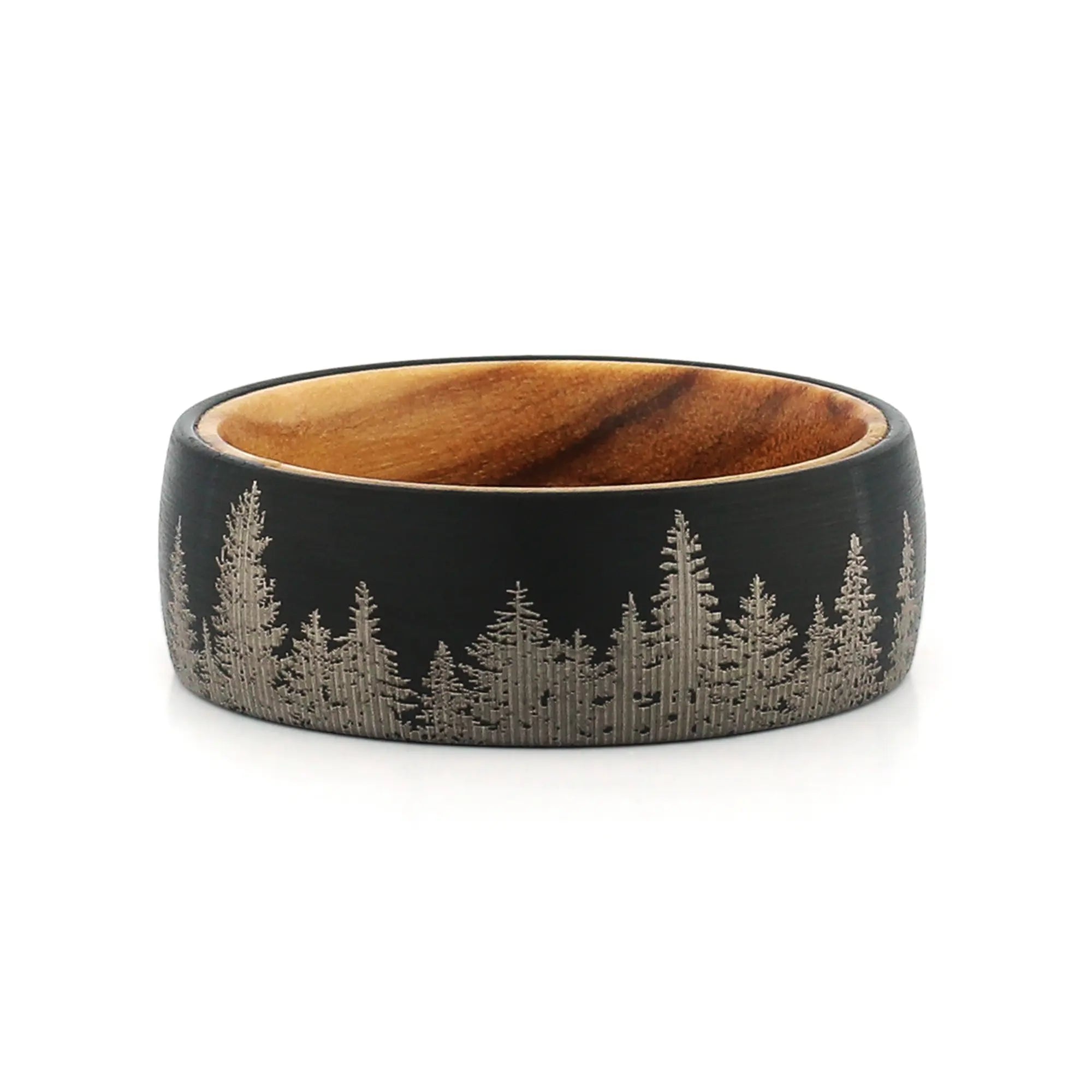 Top view of an 8mm men's black tungsten wedding band with a forest engraving and real wood inlay.