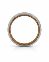 Side profile of a men's brushed tungsten wedding band with a real whiskey barrel wood inlay.